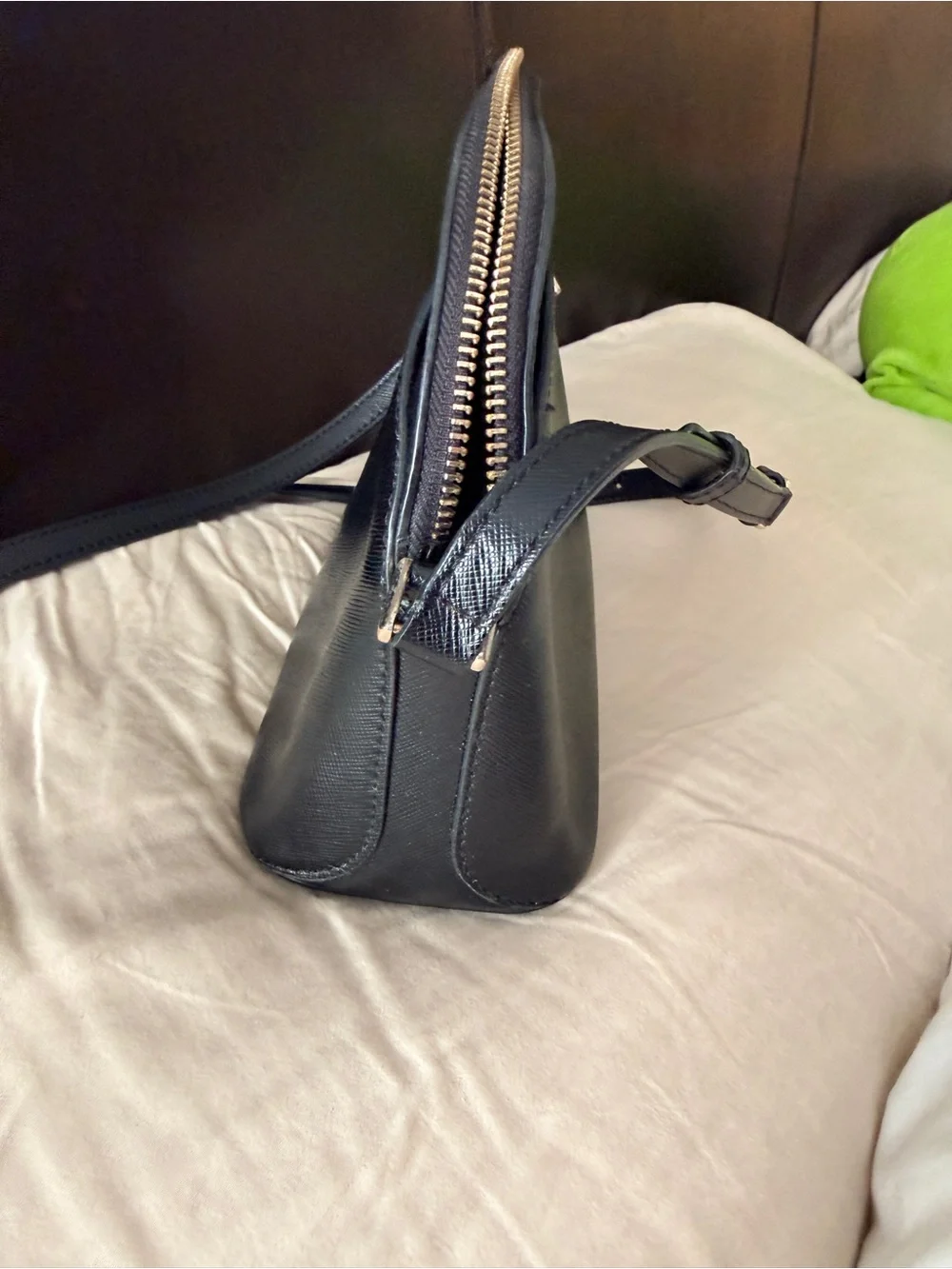 Kate Spade New York Payton Dome Crossbody in black saffiano leather.